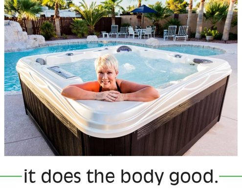 Woman relaxing in Island series hot tub by Artesian Spas