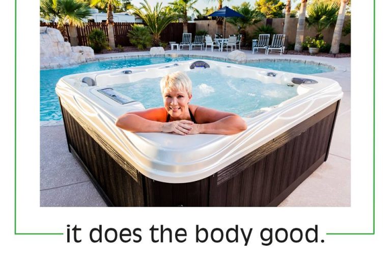 Woman relaxing in Island series hot tub by Artesian Spas