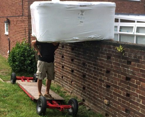 Hot tub installation at customer’s home over wall