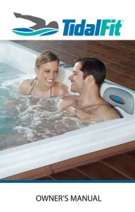 Couple relaxing in their hot tub by Artesian Spas