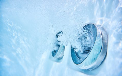 underwater view of outdoor whirlpool with active massage jets